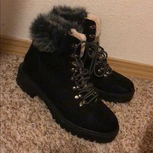 Black timberland looking botties